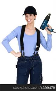 Woman holding up an electric screwdriver