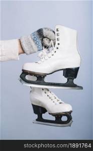 woman holding white skates hand. Resolution and high quality beautiful photo. woman holding white skates hand. High quality and resolution beautiful photo concept
