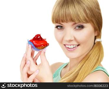 Woman holds cake strawberry cupcake . Woman holds cake cupcake in hand unhealthy food snack. Bakery sweet eating happiness and people concept.