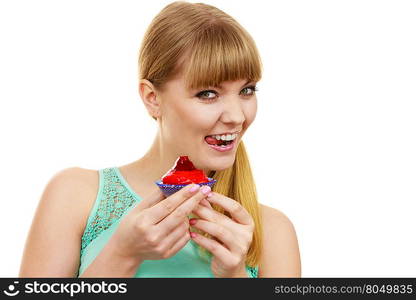 Woman holds cake strawberry cupcake . Woman holds cake cupcake in hand unhealthy food snack. Bakery sweet eating happiness and people concept.