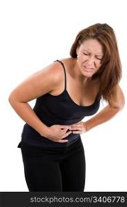 Woman holds her stomach and bends over in pain from abdominal cramps.