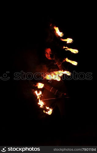 Woman holds in his hand the fire.