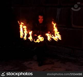 Woman holds in his hand the fire.&#xA;