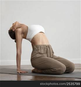 woman home practicing yoga