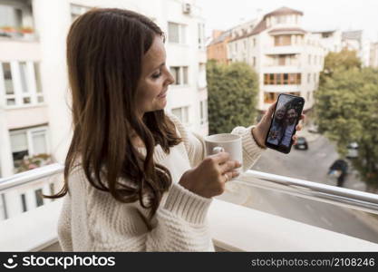 woman home video calling friends quarantine with coffee