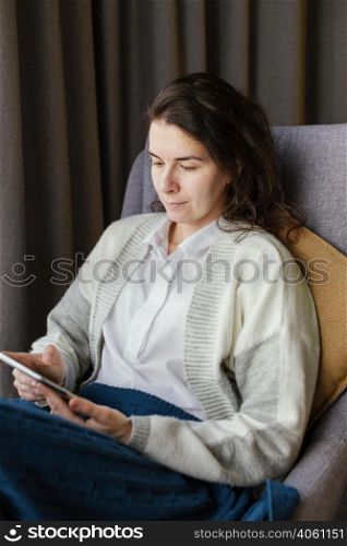 woman home with tablet