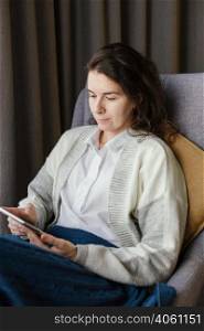 woman home with tablet