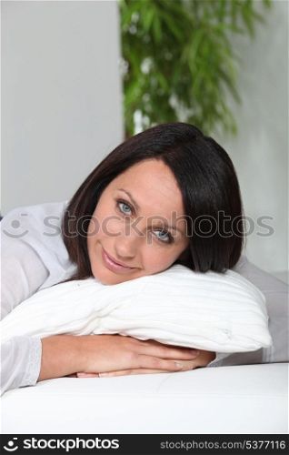 Woman hugging a pillow