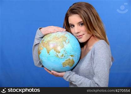 Woman hugging globe