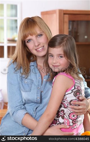 Woman hugging her daughter
