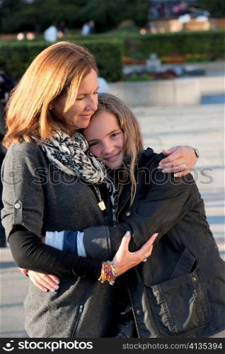 Woman hugging her daughter, Oslo, Norway