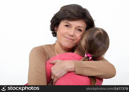 Woman hugging her granddaughter