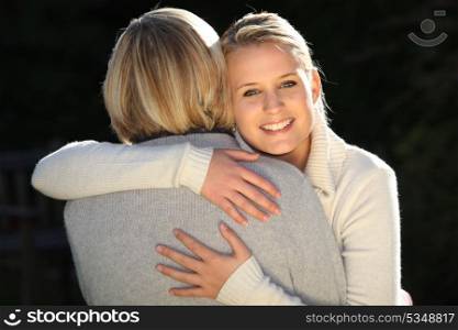 Woman hugging her mother