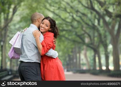 Woman hugging man