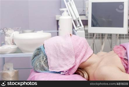 Woman in a beauty salon with a towel