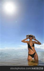 Woman in a bikini and polka dot hat