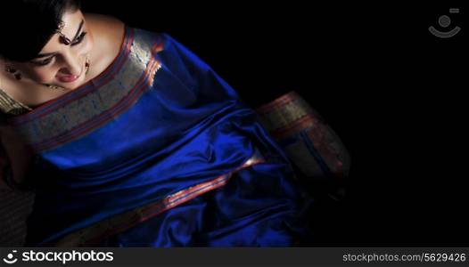 Woman in a blue saree