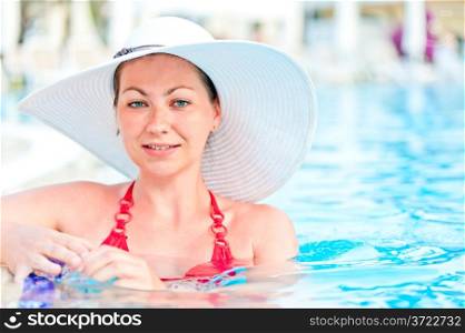 woman in a blue swimming pool water