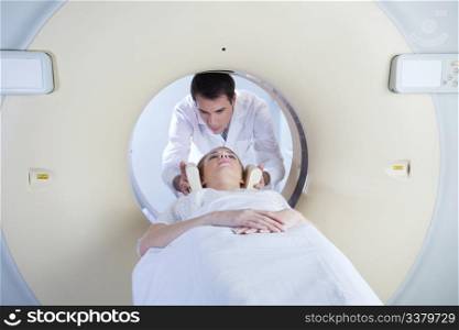 woman in a ct scan with medical professional
