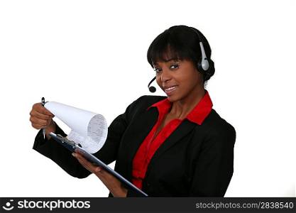 Woman in a headset with a clipboard