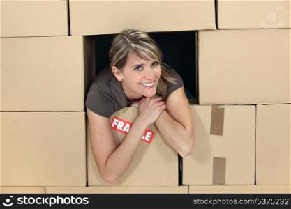 woman in a house made of carton