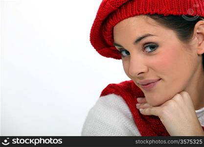 Woman in a knitted beret and scarf