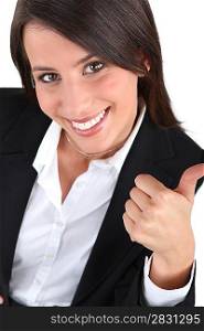 Woman in a suit giving the thumbs up