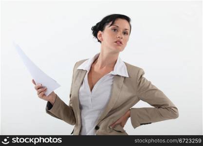 woman in a suit holding documents