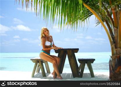 woman in a tropical cafe