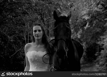 Woman in a wedding dress on a horse.