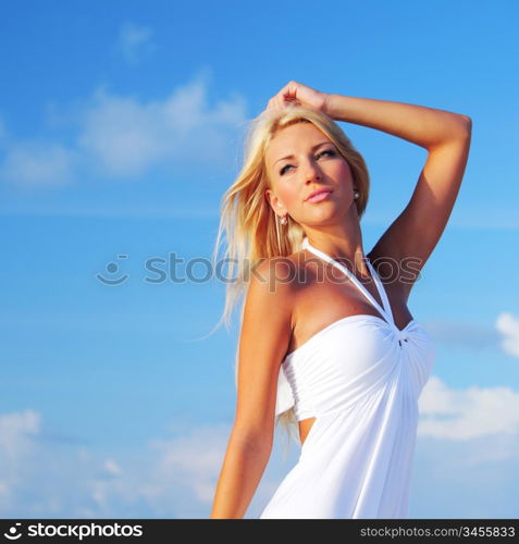 woman in a white dress on the ocean coast