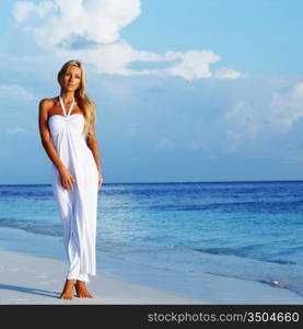 woman in a white dress on the ocean coast