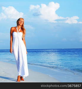 woman in a white dress on the ocean coast