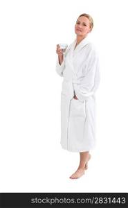 Woman in bath robe with a glass of water