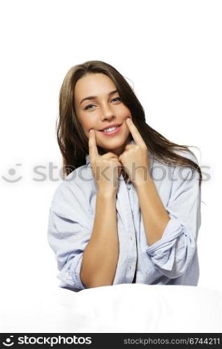 woman in bed forcing herself to smile. woman in bed forcing herself to smile on white background
