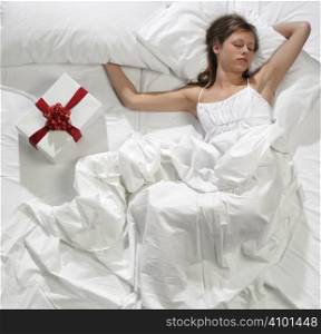woman in bed with his present