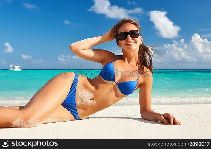 Woman in bikini at tropical beach