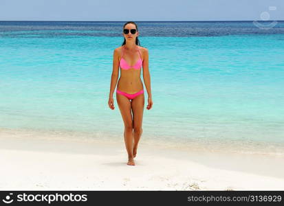 Woman in bikini at tropical beach