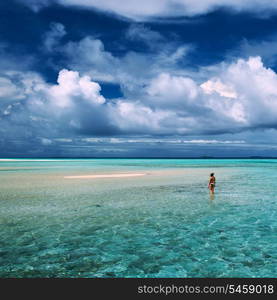 Woman in bikini at tropical beach