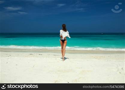 Woman in bikini at tropical beach