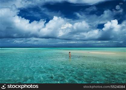 Woman in bikini at tropical beach