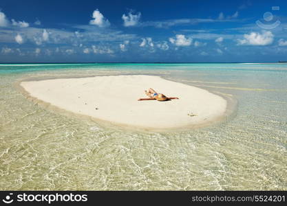 Woman in bikini at tropical beach