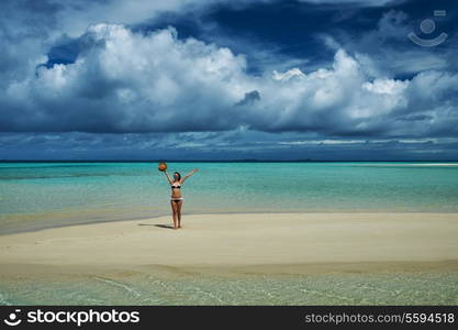 Woman in bikini at tropical beach