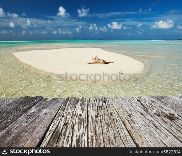 Woman in bikini at tropical beach