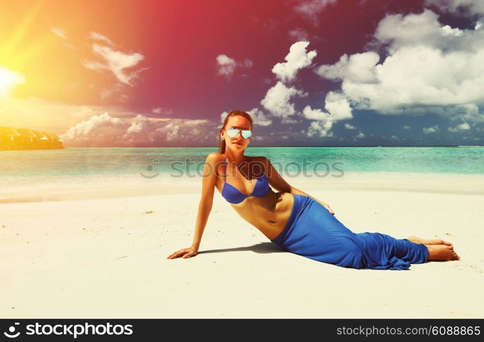 Woman in bikini at tropical beach