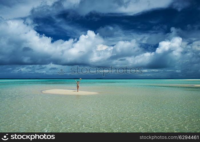 Woman in bikini at tropical beach