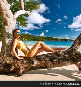Woman in bikini at tropical beach at Seychelles