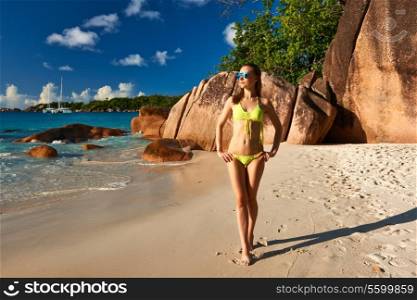 Woman in bikini at tropical beach at Seychelles
