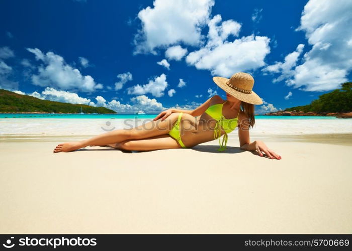 Woman in bikini at tropical beach at Seychelles