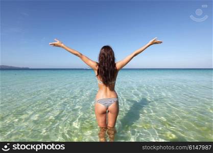 Woman in bikini in sea. Beautiful young woman in bikini posing in sea